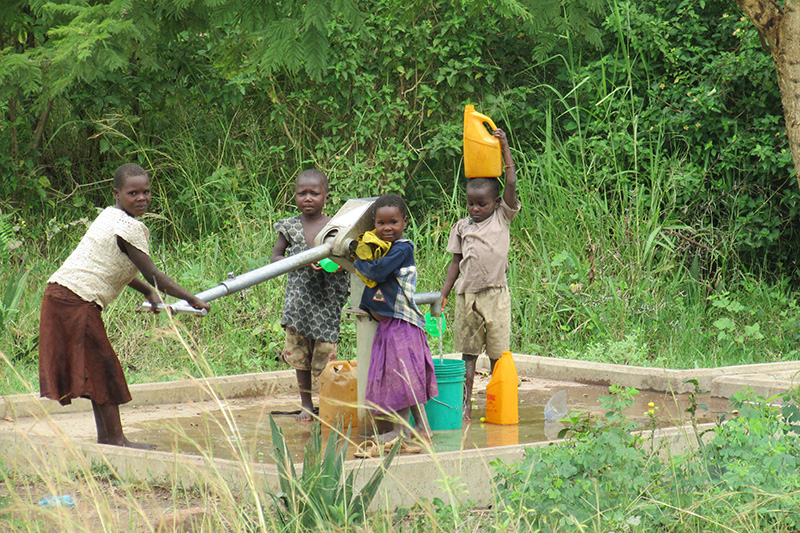 children getting water
