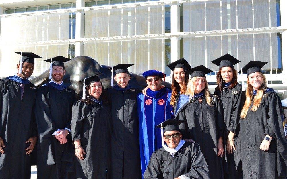 Cohort 5 students pose together at commencement